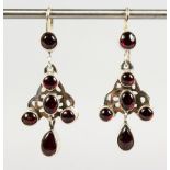 A PAIR OF SILVER AND GARNET EARRINGS.