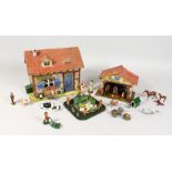 A PAINTED WOOD MODEL OF A FARMHOUSE, with similar stable block, numerous animals and accessories.