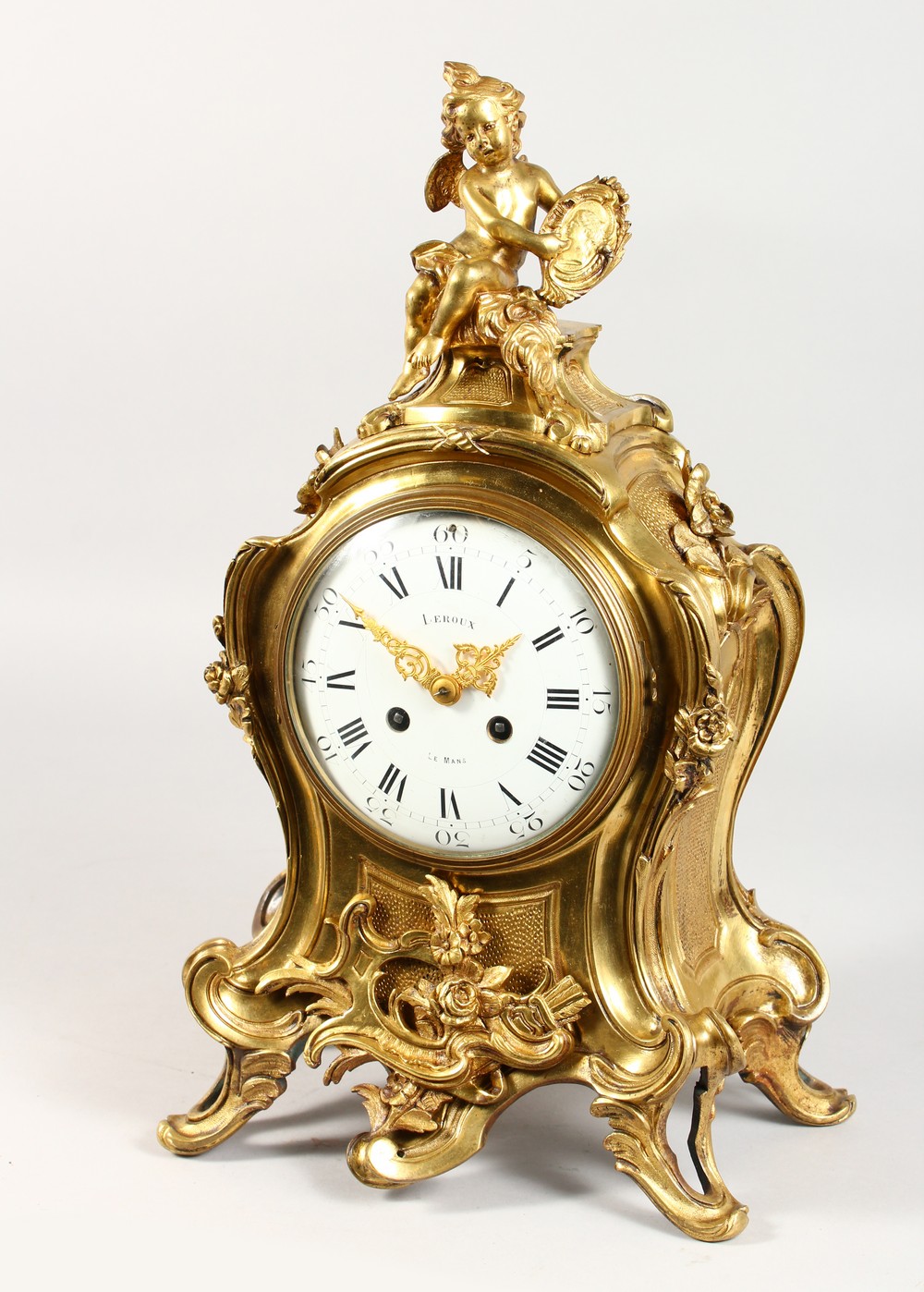 A GOOD LOUIS XVI HEAVY ORMOLU CLOCK by LEROUX, LE MANS, the case with cupids, scrolls, acanthus