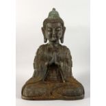 A LARGE CHINESE BRONZE FIGURE OF A SEATED BUDDHA. 17ins high.