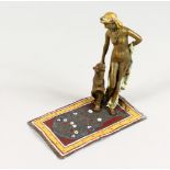 A VIENNA STYLE COLD PAINTED BRONZE, of a lady with a big cat by her side, on a Persian carpet.