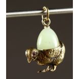 A SMALL RUSSIAN SILVER AND JADE EGG CHICK PENDANT. 1ins long.