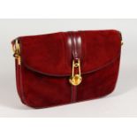 A GUCCI MAROON SUEDE AND LEATHER BAG AND STRAP, Made in Italy, in a Gucci bag.