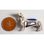 A CAST SILVER NOVELTY DACHSHUND PIN CUSHION.