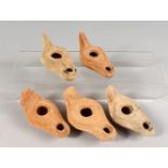 FIVE SMALL ROMAN POTTERY OIL LAMPS.