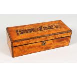 A TUNBRIDGE WARE LONG BOX, in maplewood, the hinged lid inlaid with roses, with carved edge and
