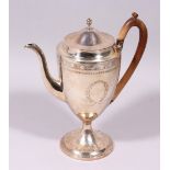 A GEORGE III COFFEE POT, with wooden handle and engraved body. London 1798. Maker: I.R. Weight