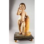 A VERY GOOD 18TH CENTURY PAINTED GESSO AND CARVED WOOD MODEL OF A CHERUB, standing next to a faux