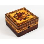 A TUNBRIDGE WARE MARQUETRY AND PARQUETRY SQUARE BOX, the hinged lid with a rose. 4ins square.