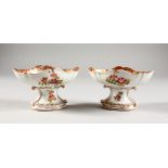 A PAIR OF AUGUSTUS REX NAVETTE SHAPED PEDESTAL SALTS, each richly decorated with figures in a