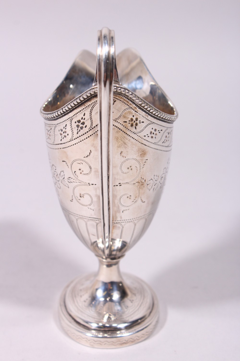 A GOOD GEORGE III ENGRAVED HELMET SHAPED MILK JUG, with reeded handle and base. London 1782. - Image 5 of 9