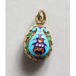 A SMALL RUSSIAN SILVER AND ENAMEL EGG SHAPED PENDANT. 0.75ins long.