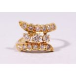 AN 18CT YELLOW GOLD THREE ROW CROSSOVER RING of 1ct approx.