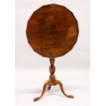 AN 18TH CENTURY YEW WOOD TILT TOP TRIPOD TABLE, with a shaped top, later edged, on a turned column