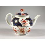 AN 18TH CENTURY WORCESTER TEAPOT AND COVER, painted with panels in Imari style.