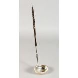 A SILVER TODDY LADLE, with oval bowl and twisted horn handle. 13ins long.