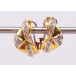 A PAIR OF 18CT YELLOW GOLD AND DIAMOND EARRINGS.