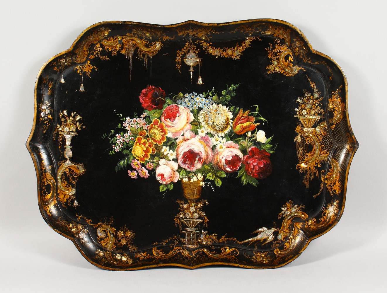 A GOOD LARGE VICTORIAN PAPIER MACHE SHAPED RECTANGULAR TRAY, painted to the centre with a vase of