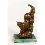 AN ART DECO STYLE BRONZE MODEL OF A PANTHER, descending a mountain, on a marble base. 13.5ins high.