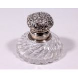 A STERLING SILVER TOP CIRCULAR GLASS INKWELL. 3.5ins diameter.