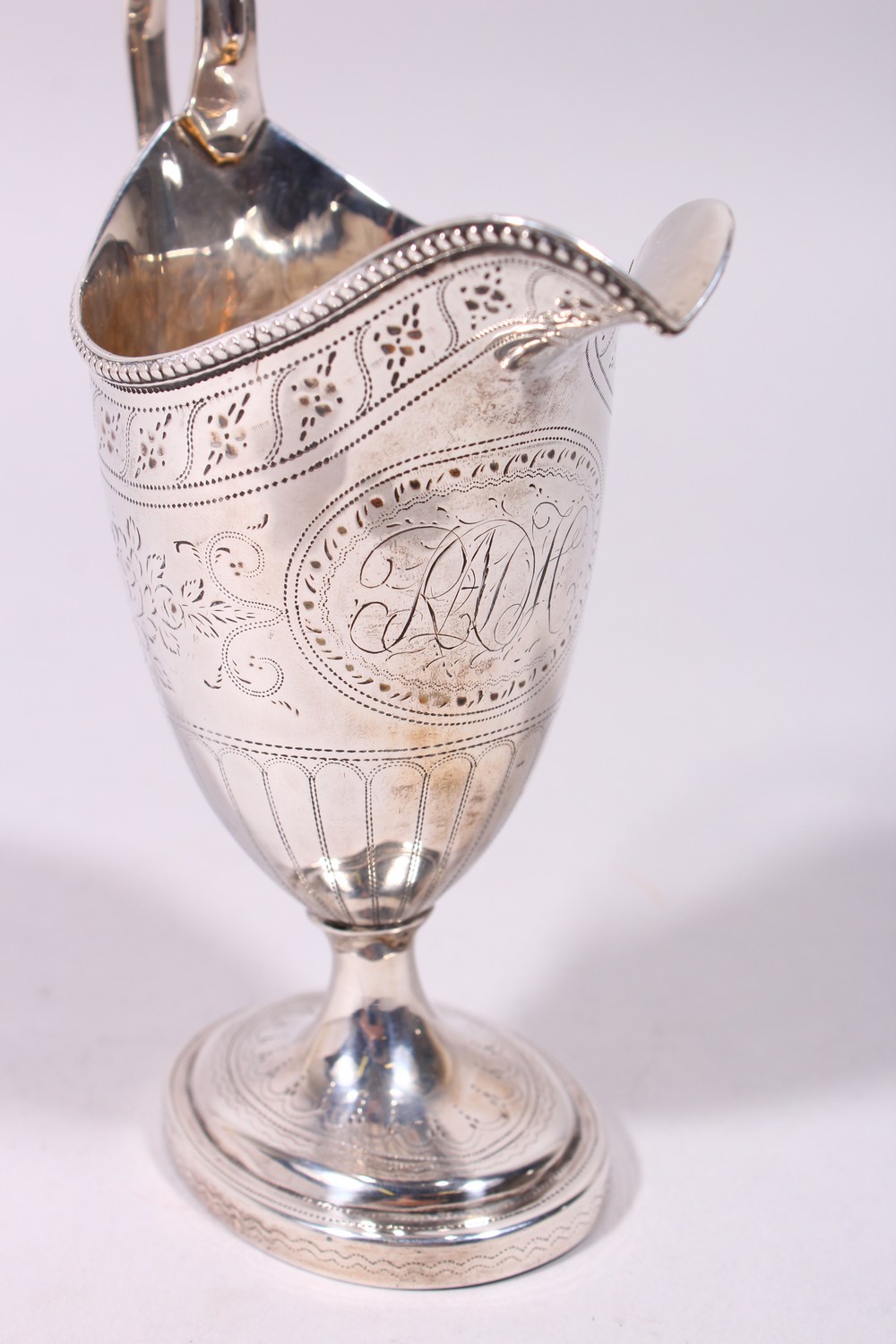 A GOOD GEORGE III ENGRAVED HELMET SHAPED MILK JUG, with reeded handle and base. London 1782. - Image 2 of 9