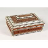 A GOOD 19TH CENTURY INDIAN CARVED SANDALWOOD AND IVORY SEWING CASKET, with well fitted interior.