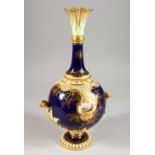 A COALPORT VASE OF SPHERICAL FORM, with tall flared neck painted with a Scottish loch landscape,