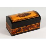 A TUNBRIDGE WARE DOMED TOP THREE-DIVISION STATIONERY BOX, the lid with roses. 7.75ins long.