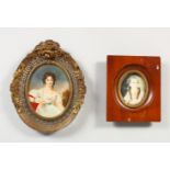 AN OVAL PORTRAIT MINIATURE OF A LADY WEARING A WHITE DRESS, in a pierced metal frame, and another
