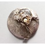 AN ART NOUVEAU SILVER AND PEARL BROOCH by ADB.