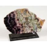 A POLISHED BLUE JOHN STYLE QUARTZ SPECIMEN, mounted on a stand. 7.5ins wide.