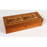 A TUNBRIDGE WARE LONG BOX, the hinged lid inlaid with roses and parquetry. 9.25ins long x 3.25ins