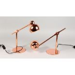 A PAIR OF COPPER ANGLEPOISE DESK LAMPS.