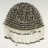 A BEAD HAT, CIRCA. 1920.