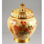 A ROYAL WORCESTER BLUSH IVORY POTPOURRI and two covers, painted with flowers on a blush ivory