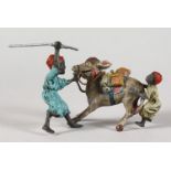 A PAINTED COLD CAST GROUP, TWO MEN WITH A DONKEY. 4ins long.