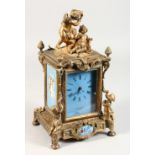 A FRENCH GILT BRONZE CLOCK, VINCENTI ROSE, the top with cupid, the sides painted porcelain panels.