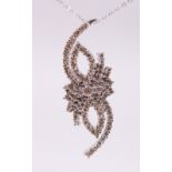 AN 18CT WHITE GOLD DIAMOND SET PENDANT NECKLACE of 1/2ct approx., on a gold chain.
