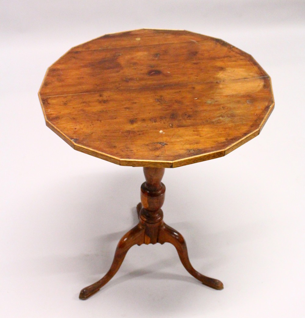 AN 18TH CENTURY YEW WOOD TILT TOP TRIPOD TABLE, with a shaped top, later edged, on a turned column - Image 5 of 5