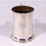 A VICTORIAN SCOTTISH SILVER PINT TANKARD, plain body with acanthus handle. Edinburgh 1863. Maker: J.