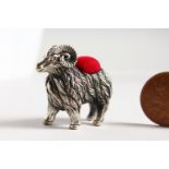 A CAST SILVER NOVELTY RAM PIN CUSHION.