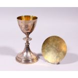 A FRENCH SILVER PLATED CHALICE AND PATEN. 6.5ins.