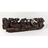 A LARGE CHINESE CARVED WOOD GROUP OF FIGURES AND TREES. 31ins long.