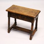 A 17TH CENTURY STYLE OAK JOINT STOOL, with rectangular top, carved frieze on stretchered, turned