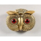 A BRASS OWL VESTA.