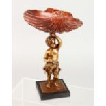 A SMALL 19TH CENTURY BRONZE MODEL OF A CHERUB, holding a shell above its head. 7.5ins high.