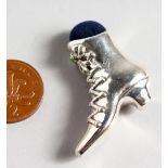 A CAST SILVER NOVELTY BOOT PIN CUSHION.