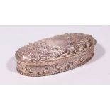 A VICTORIAN OVAL PIN BOX AND COVER, with repousse decoration. 5.25ins long. Birmingham 1839.