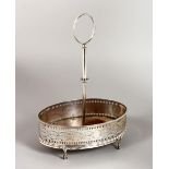 A GEORGE III OVAL CRUET STAND, with engraved decoration and pierced sides, supported on four claw