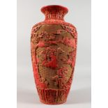 A LARGE CHINESE RED CINNABAR LACQUER VASE, incised with a mountainous landscape scene. 14.5ins